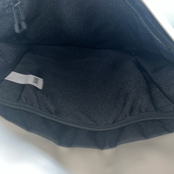 RAINS Shield Rucksack is a clean and functional backpack. Elegant Cream Backpack - Picture 11 of 11